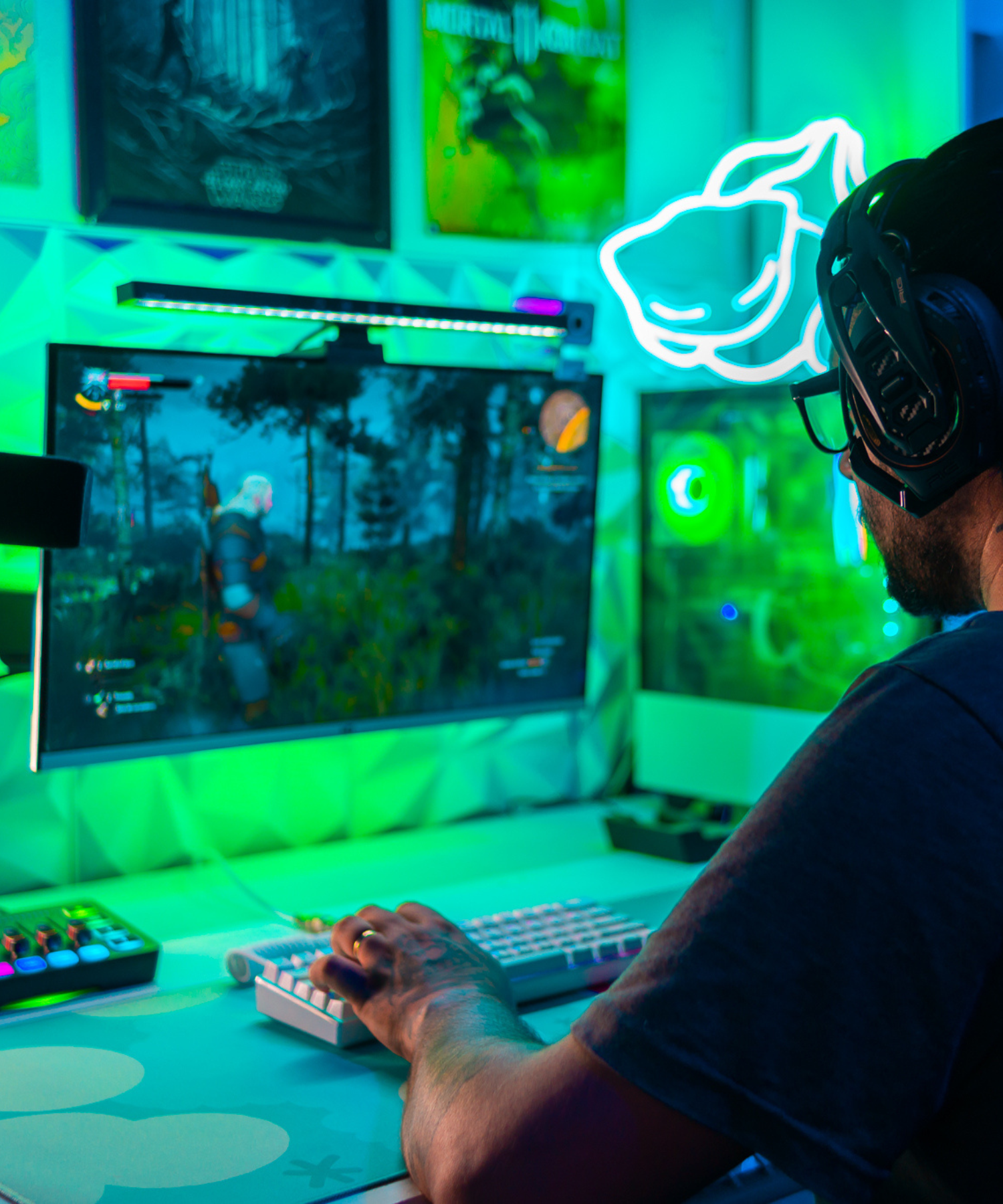 Gamer playing witcher 3 in a green gaming setup