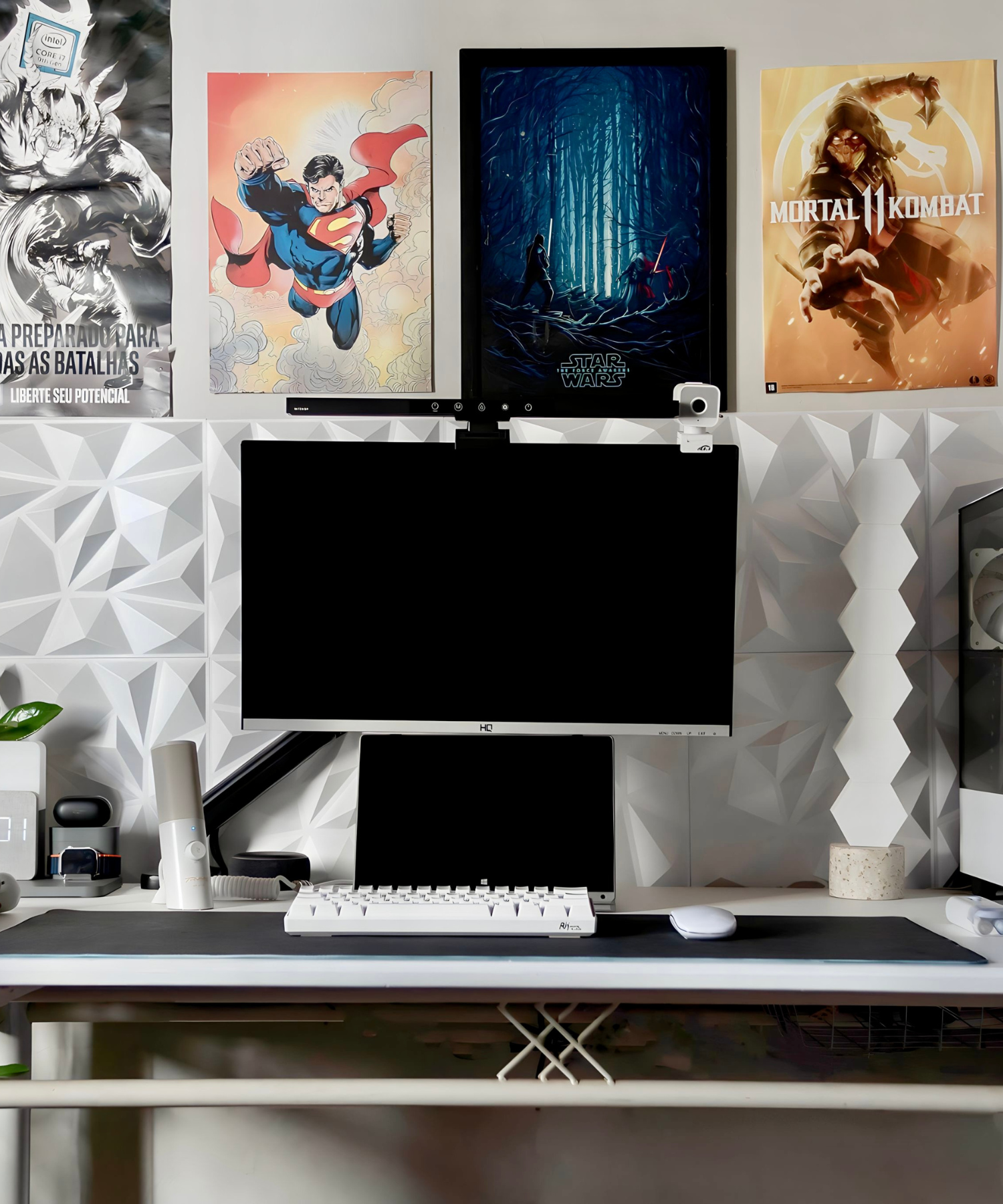 Black and white gaming setup with monitor and mechanical keyboard