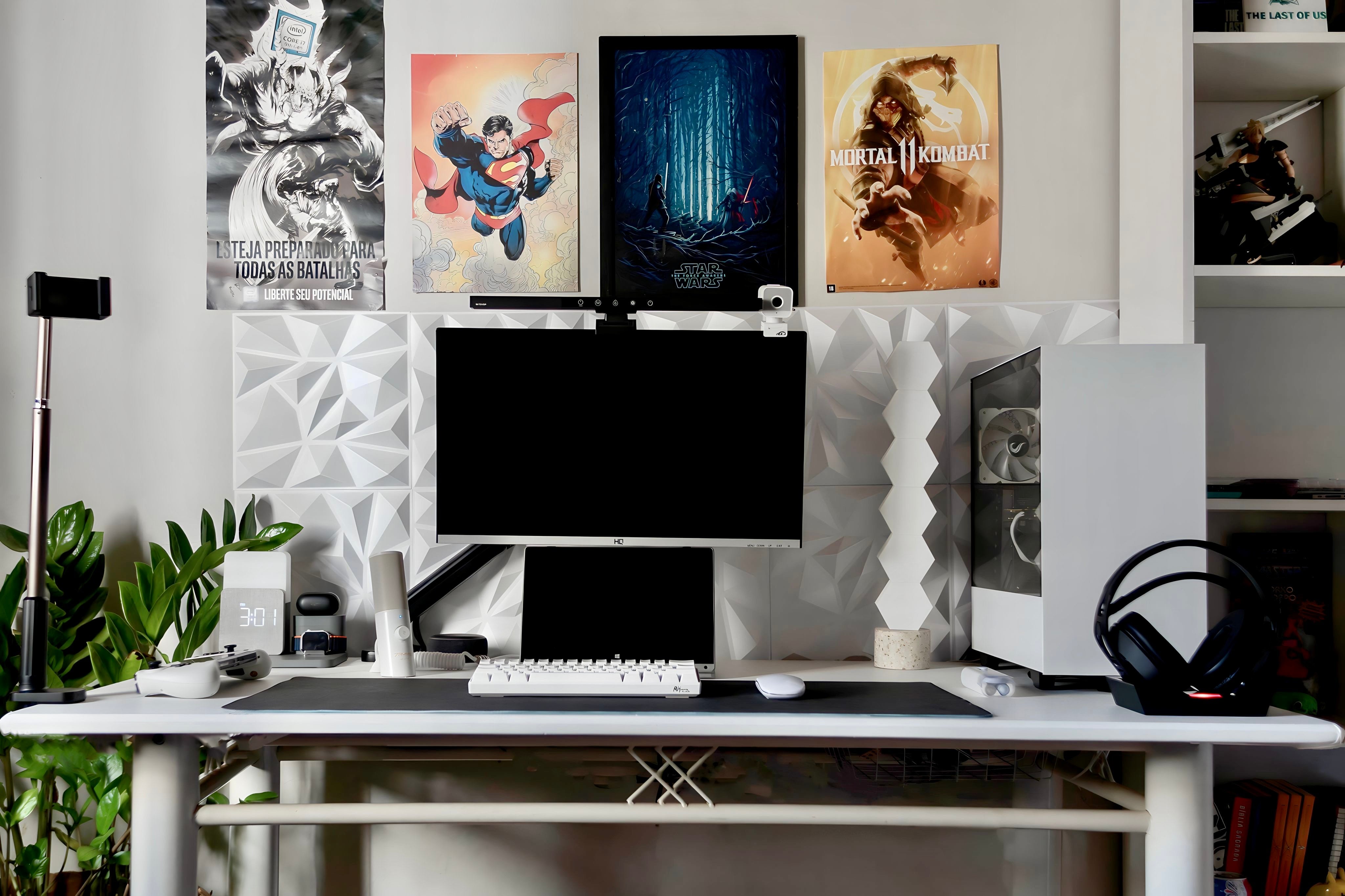 white and black asthetic gaming setup, with PC, monitor mechanical keyboard and wall art