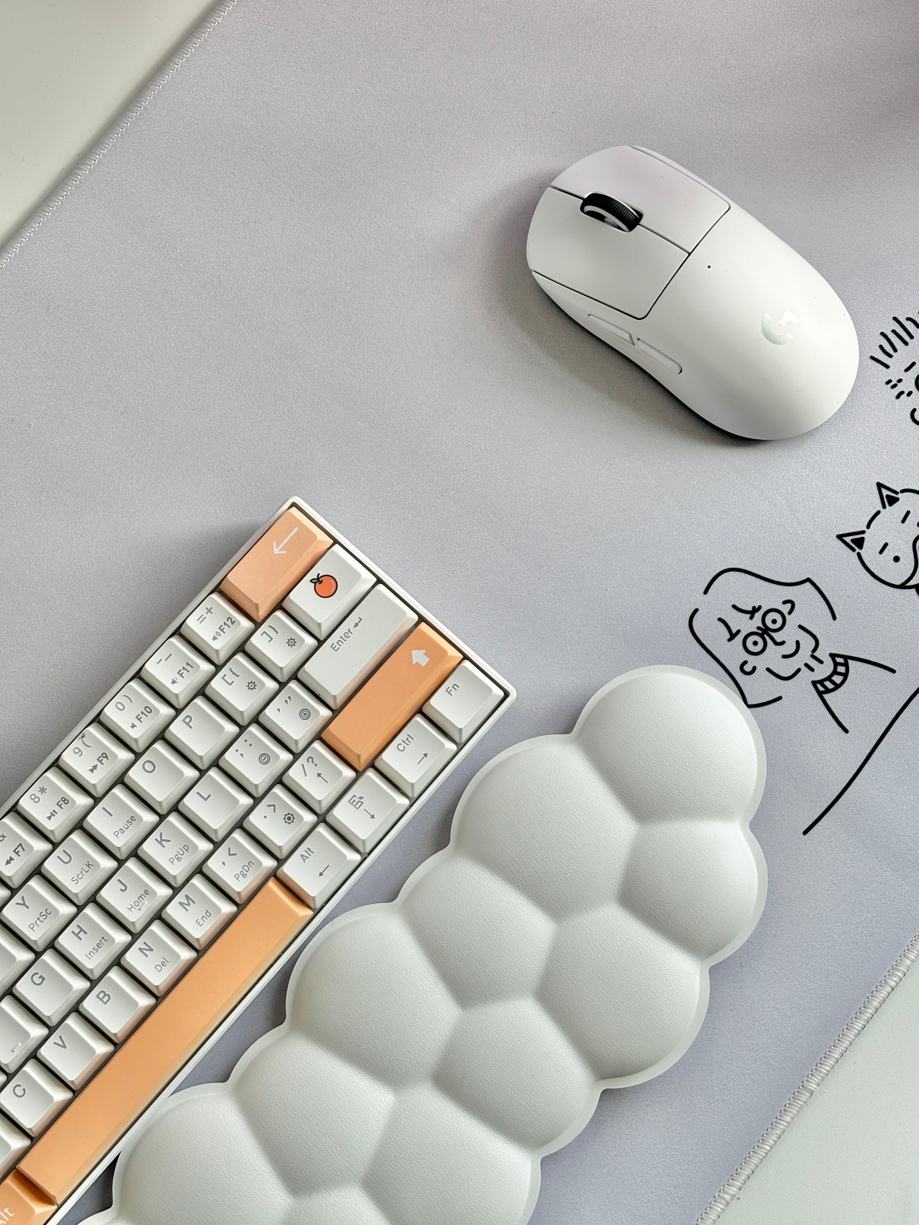 orange keycap set on white gaming keyboard with gaming mouse