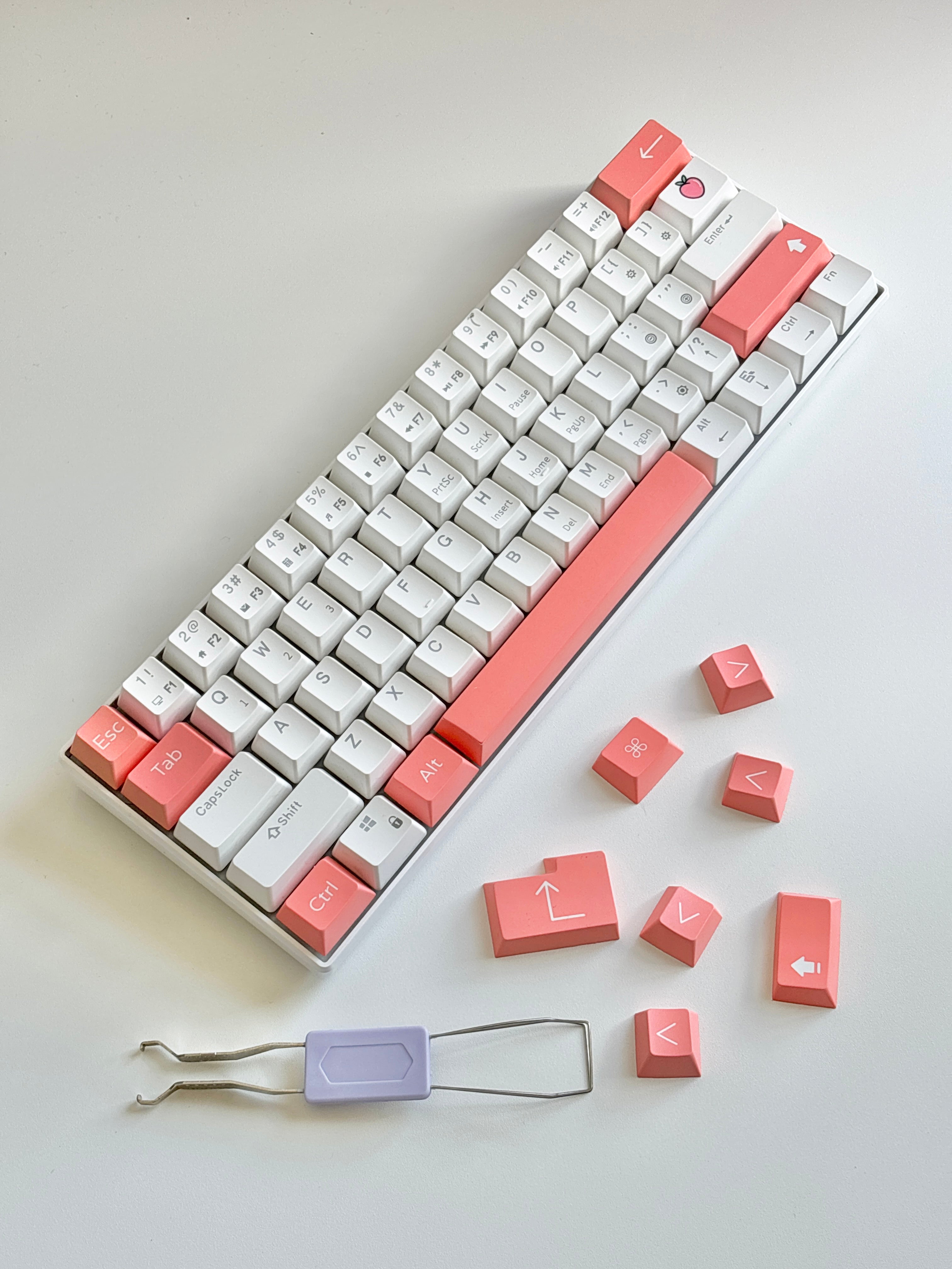 white mechanical keyboard with cute peach keycap accent set