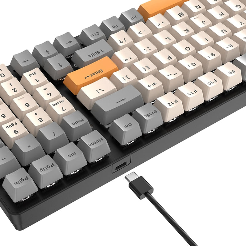 beige, grey and orange mechanical keyboard with usb c cable 