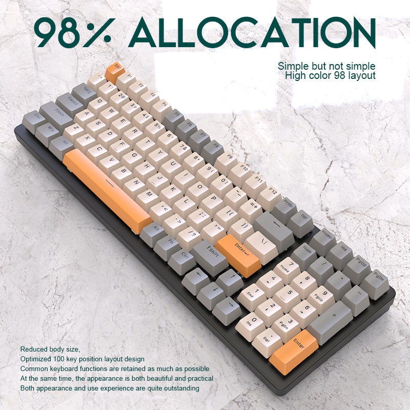 beige, grey and orange 98% mechanical keyboard on marble background