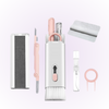 white and pink gadget cleaner, displaying keycap puller, airpod cleaner, screen wiper and spray