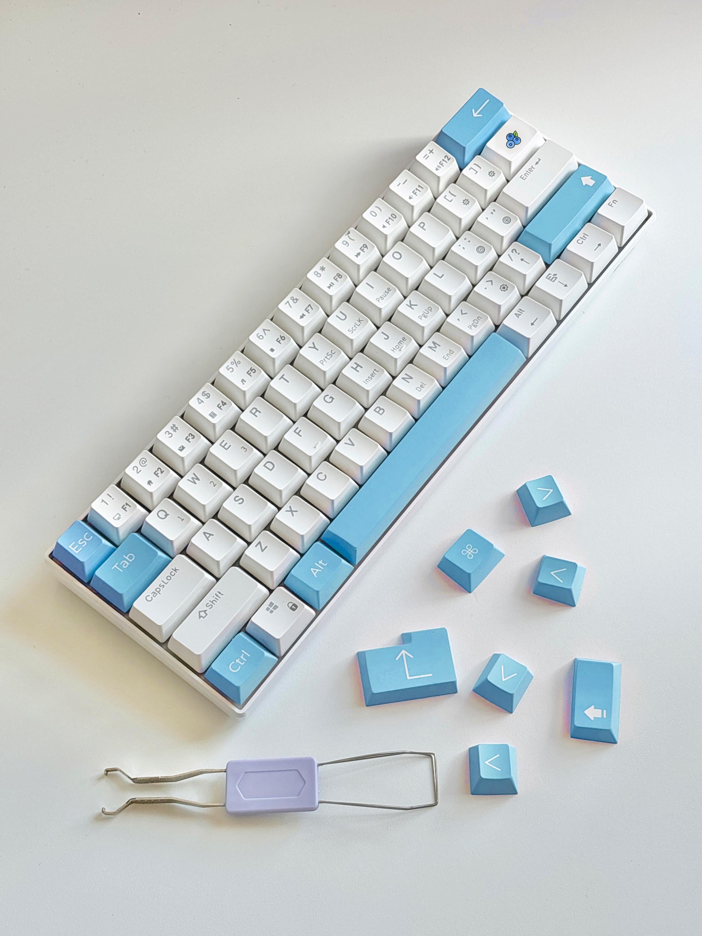 cherry profile blue custom keycaps on white mechanical keyboard with keycap puller