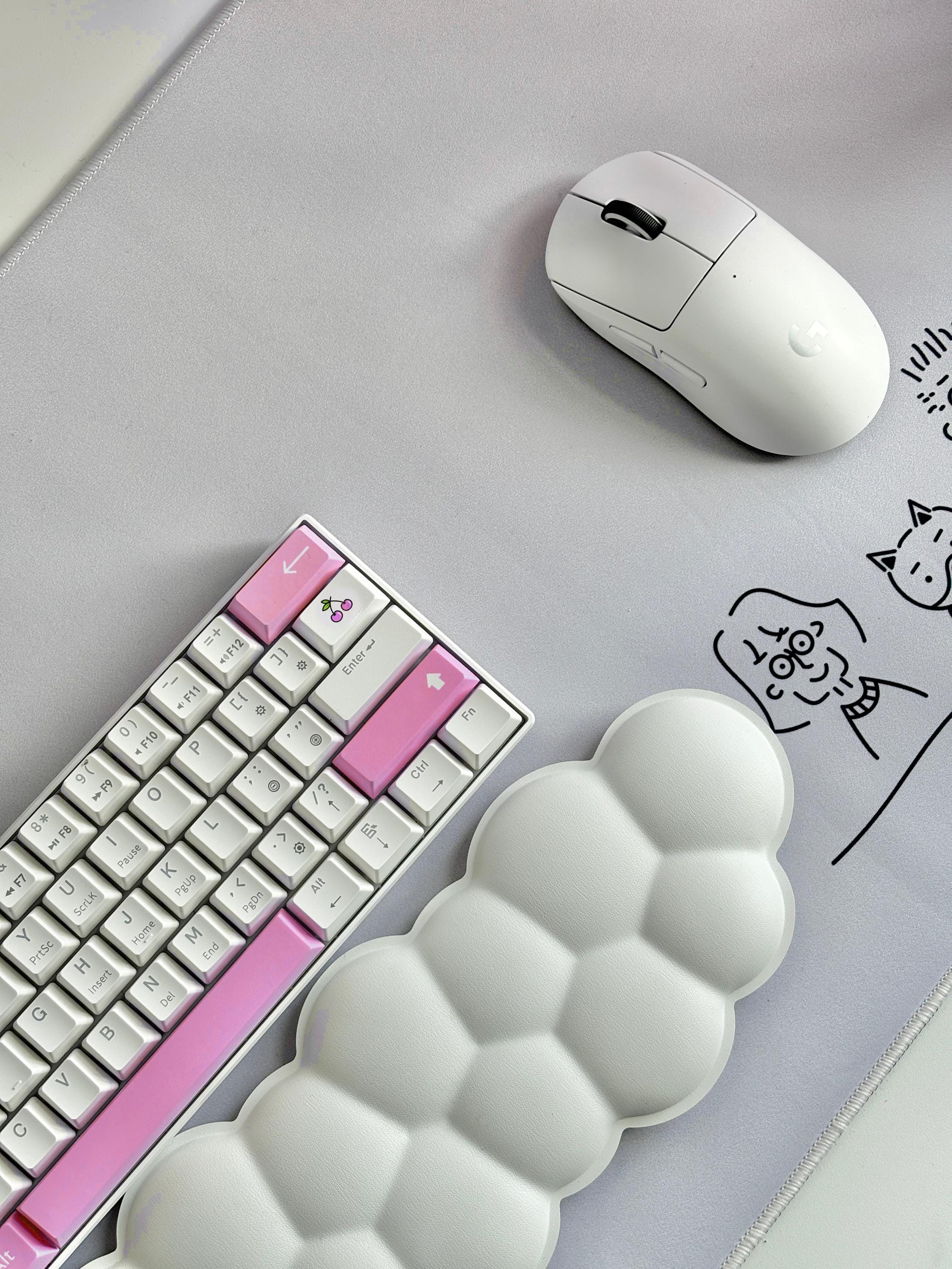 pink keycaps on white mechanical keyboard with whitecloudy wrist rest and white gaming mouse